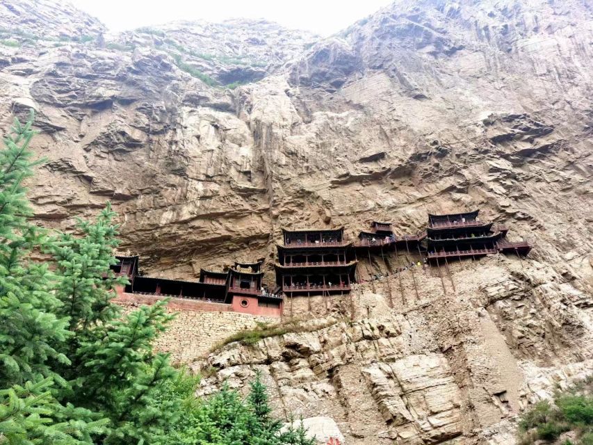 Datong: Temples and Grottoes day tour with tickets options - Reading the 53 caves at Yungang