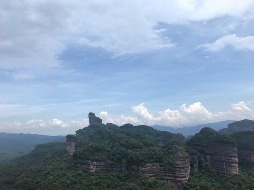From Guangzhou: Mount Danxia and Nanhua Temple Full-Day - Yang Yuan Stone and the mountain’s sense of humor