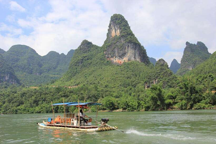 Highlights from Guilin to Yangshuo Full Day Private Tour - A one-hour bamboo raft ride on a quieter Li River stretch