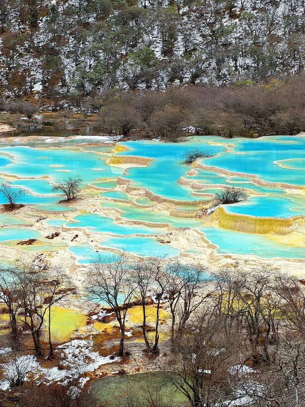 Huanglong Scenic Area: Explore Stunning Five-Colored Ponds - Why Huanglong’s pools look painted