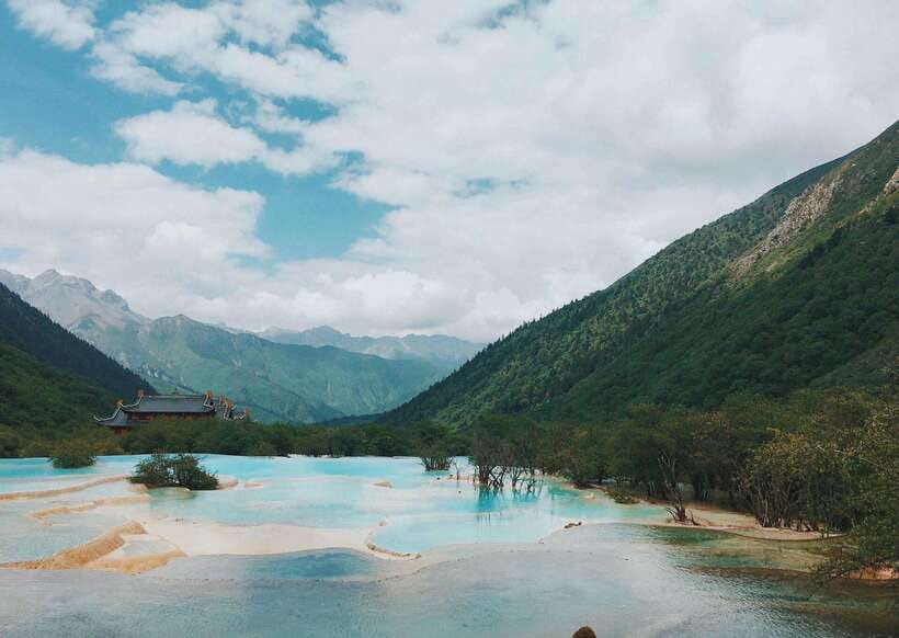 Huanglong Scenic Area: Explore Stunning Five-Colored Ponds - Ancient forest beneath the high peaks