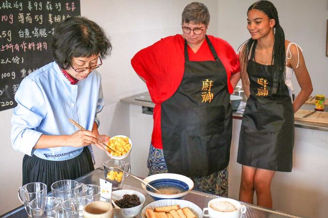 Lijiang Naxi Cuisine Cooking Class & Market Visit - Cooking three dishes with a local Naxi family