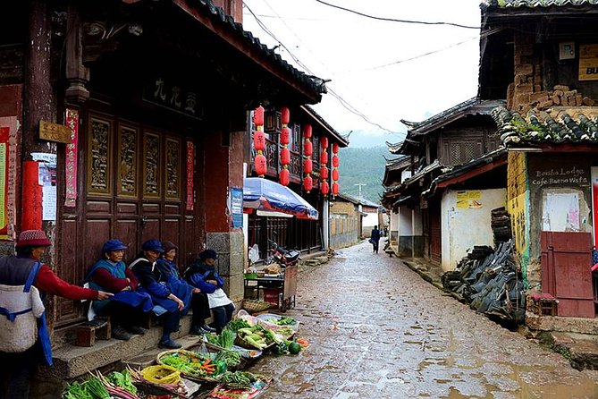 One day Jade Dragon Snow Mountain Tour with Impression Lijiang show - Walking through Baisha Old Town