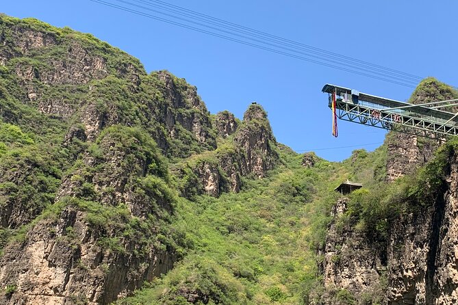 Private Day Tour to Longqing Gorge and Dingling at the Ming Tombs with Lunch and Boat Ride - Longqing Gorge: cliffs, water, and the dragon escalator