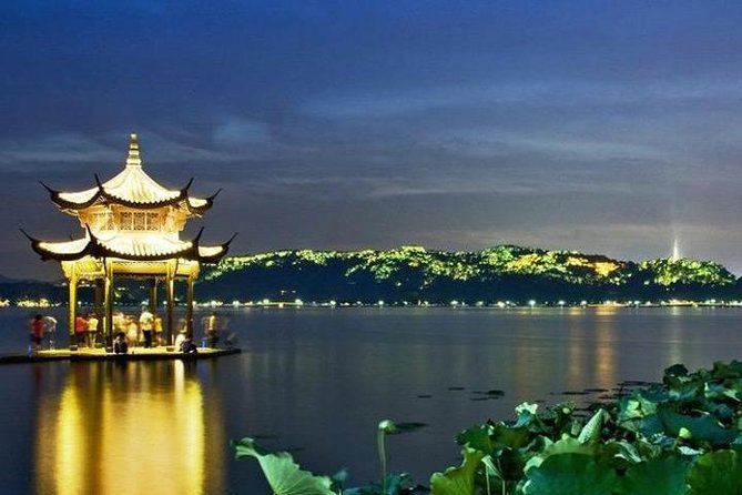 Private Full Day Tour : Customizable Hangzhou City Highlights with Multi Options - Fei Lai Feng, stone carvings in a wooded setting