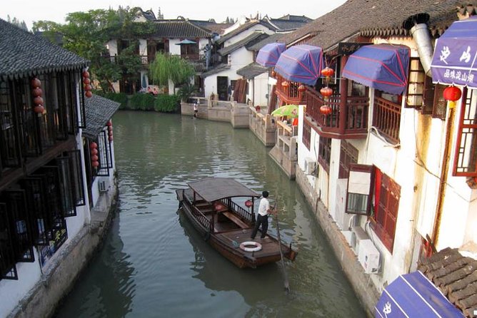Zhujiajiao Water Village & Seven Treasure Town Day Tour from Shanghai - Leaving Shanghai for Qibao’s Textile Traditions